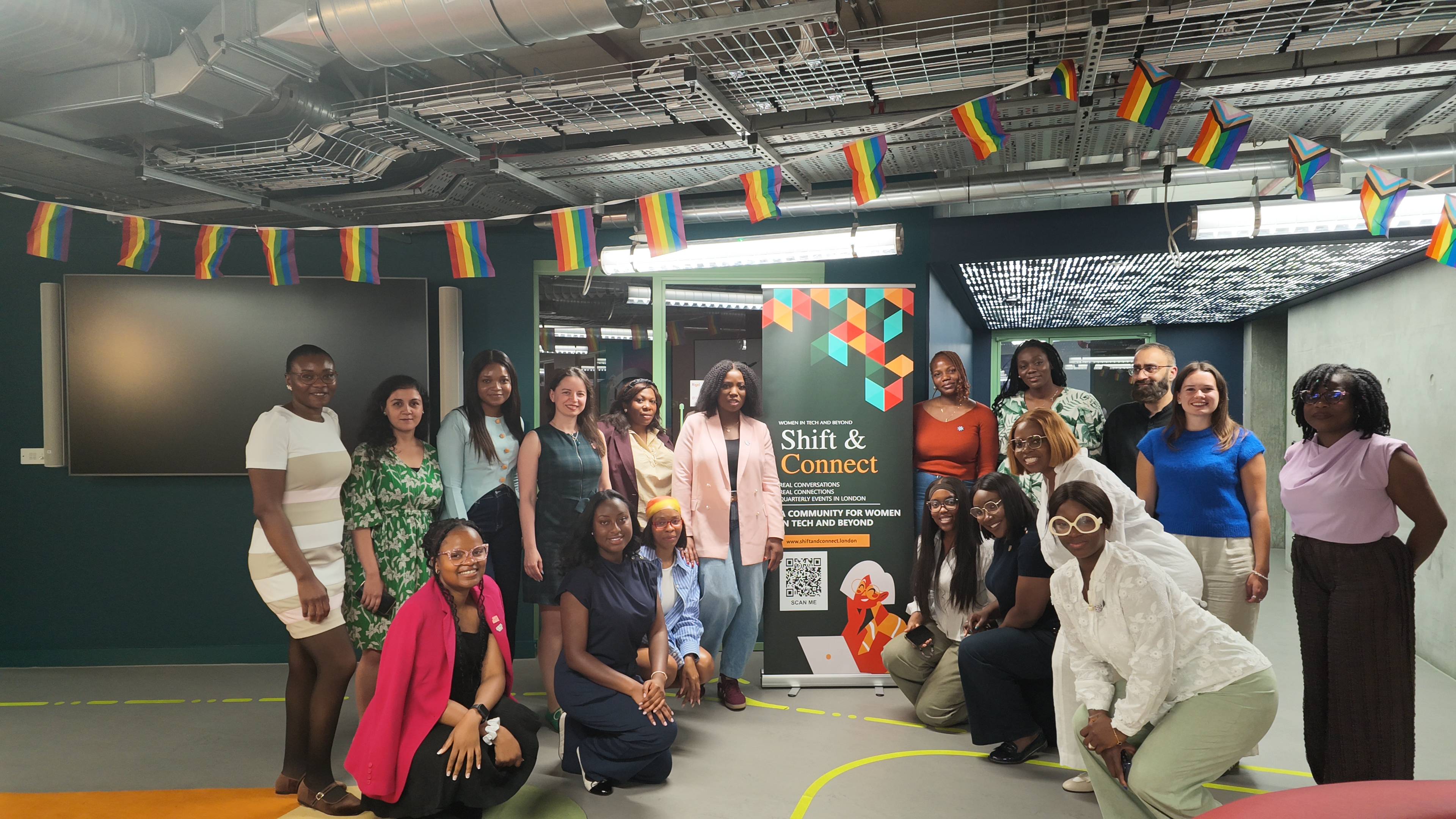 Women from the Shift & Connect community at the 2 July gathering, with the event banner